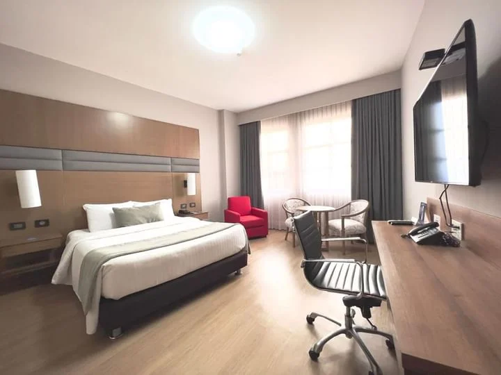 Guest room at Hotel Dann Carlton Cali