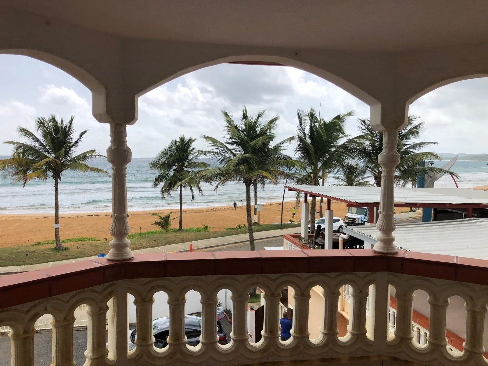 Covered terrace overlooking the coast at Luquillo Sunrise Beach Inn