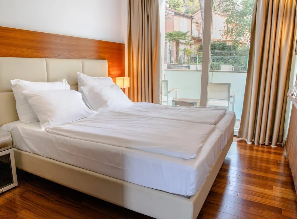 Guest room overlooking the gardens at Boutique Hotel Portorose