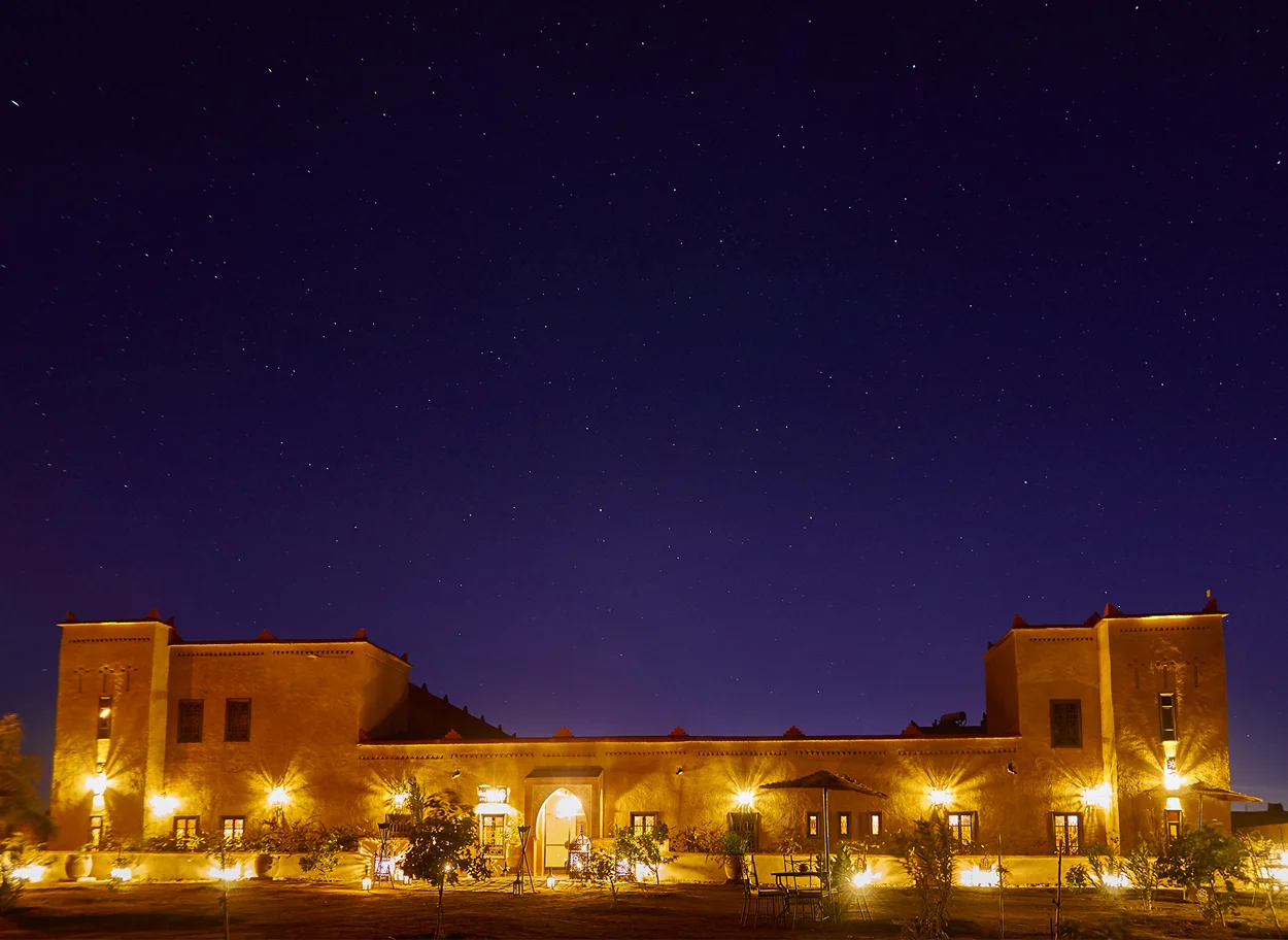 Kasbah exterior at night at Riad Madu