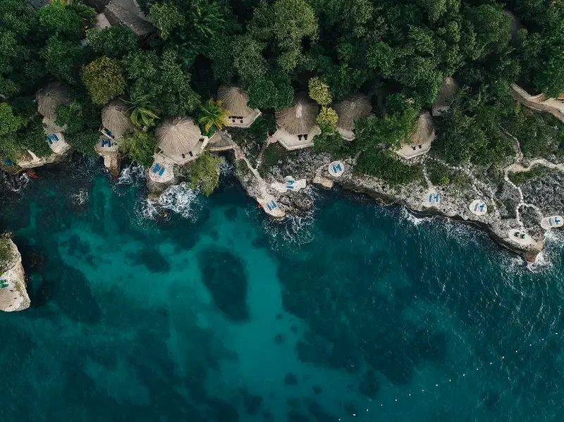 Cliffside hotel and coastline at Rockhouse Hotel