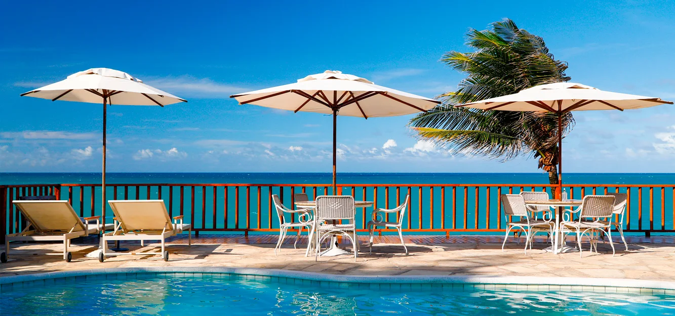 Pool terrace overlooking the beach at Manary Praia Hotel