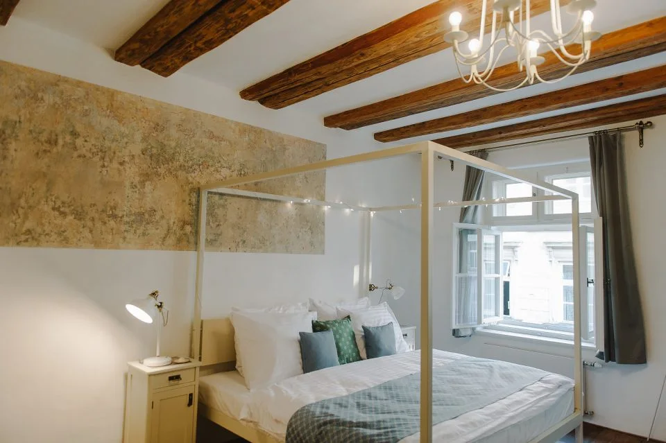 Guest room with exposed beams at Miss Sophie's Olomouc