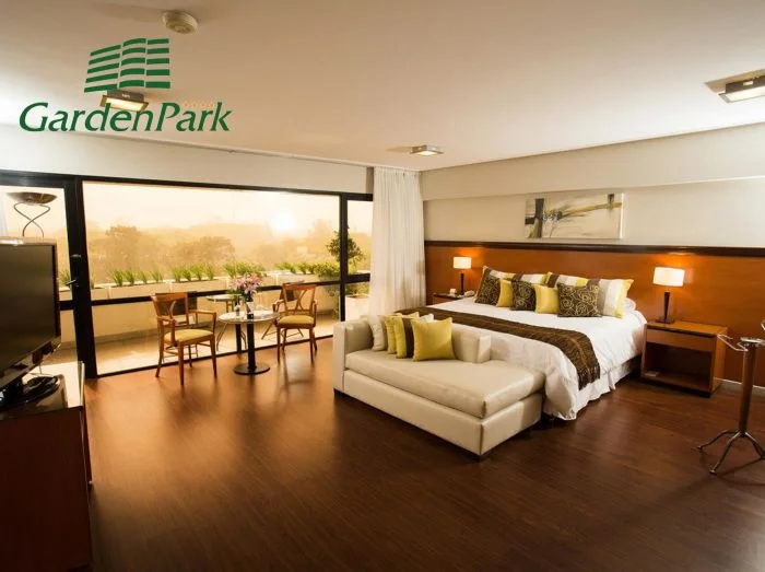 Guest room at Garden Park Suites and Eventos