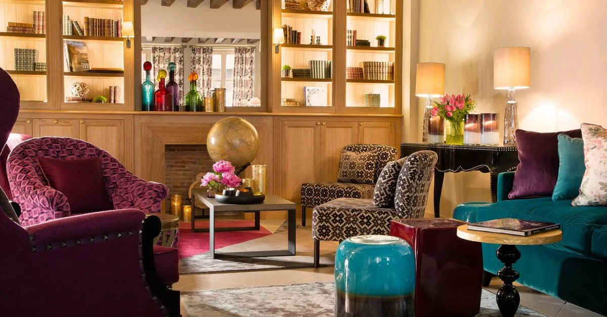 The colourful library lounge at Hôtel Les Tournelles in Paris
