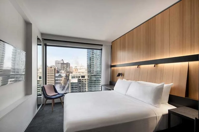 Guest room with city views at Hôtel Monville in Montréal