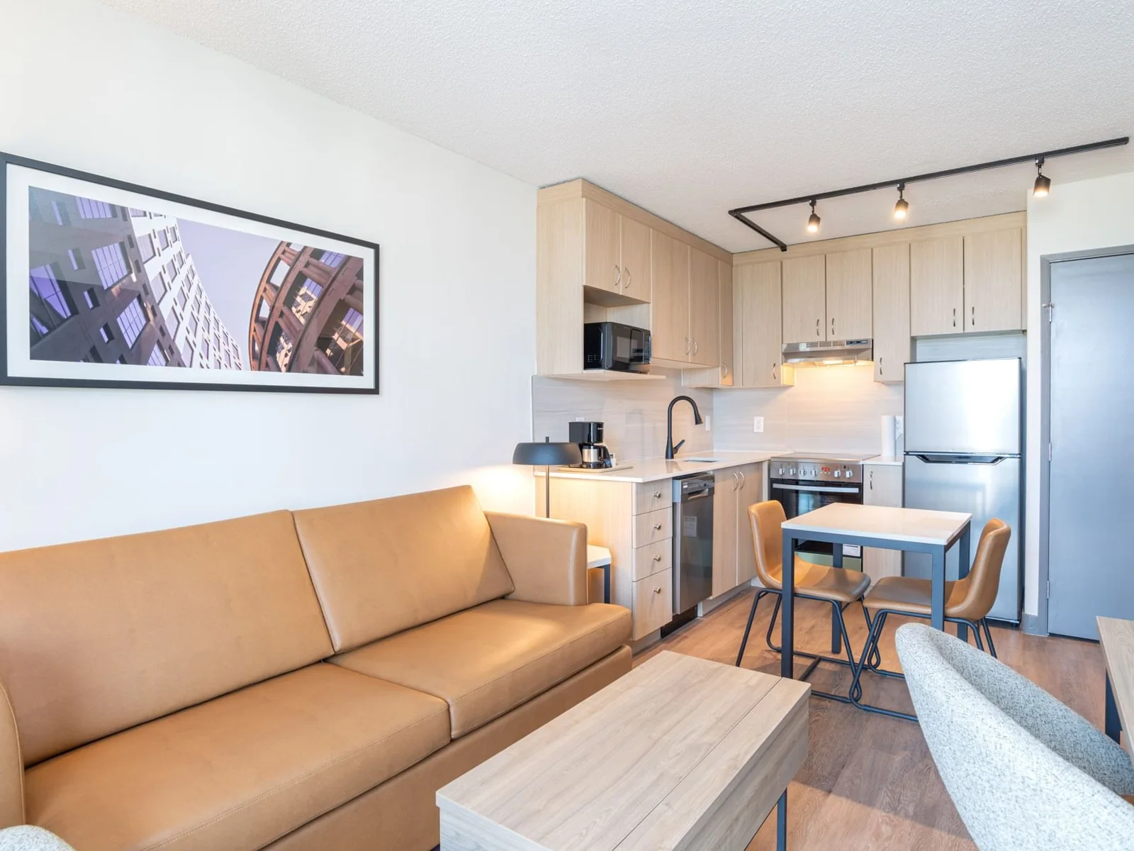 Suite living area and kitchen at Sandman Suites Vancouver-Davie Street