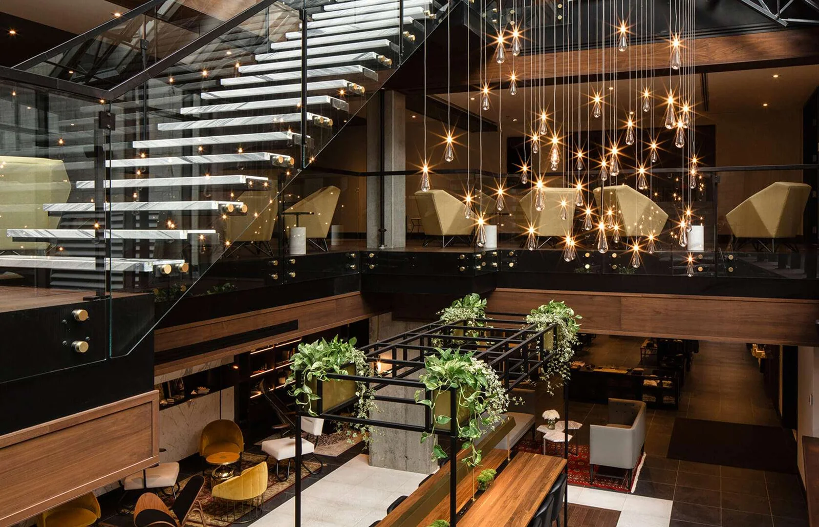 Living-room lounge and staircase at Hôtel William Gray in Montréal