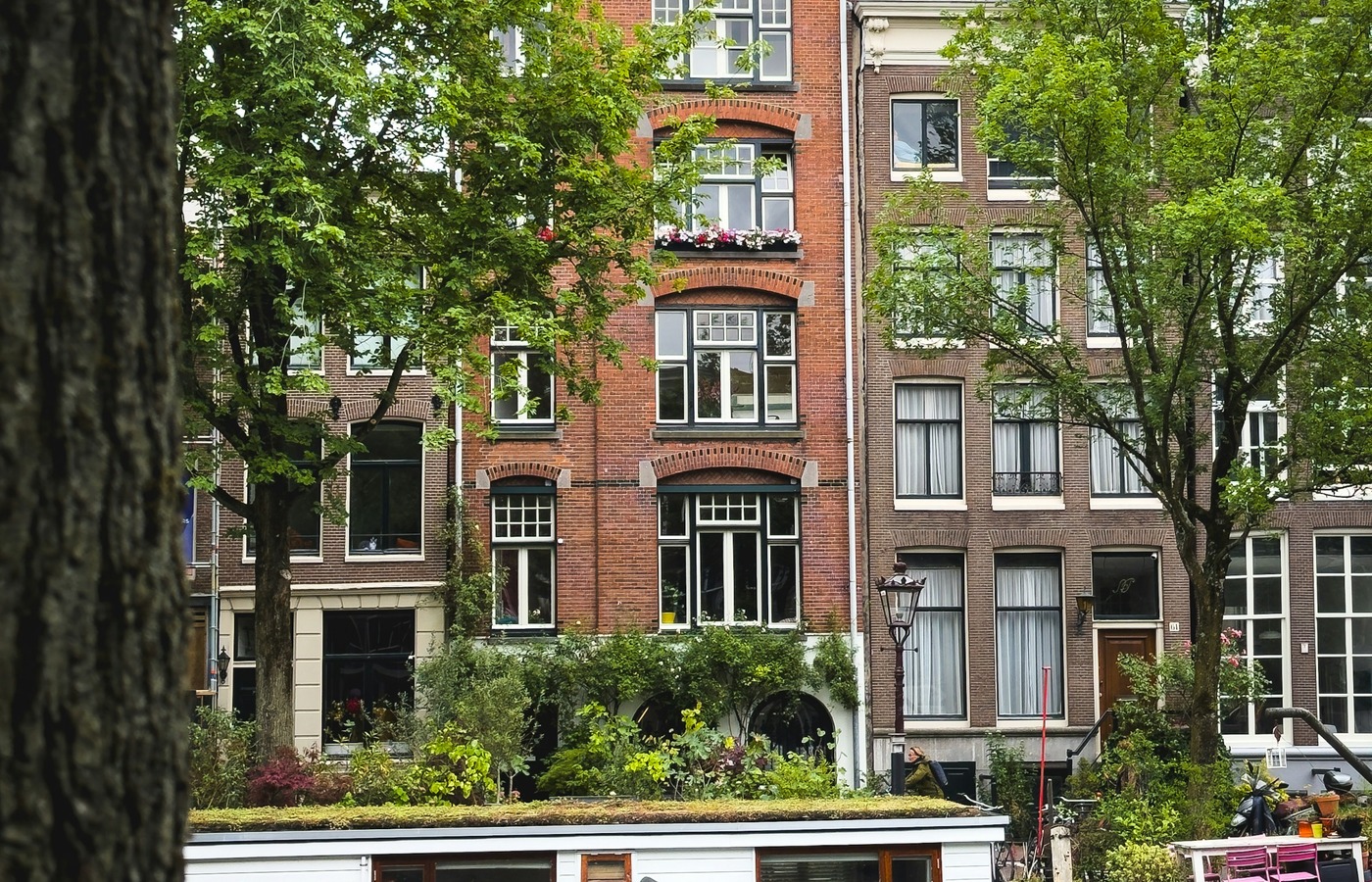Amsterdam canal houses reflected in the water