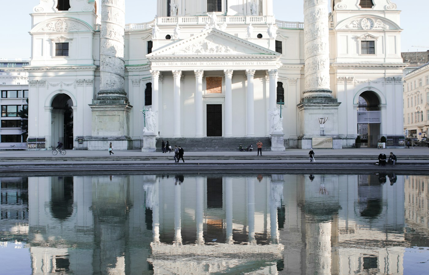 The Karlskirche façade and columns reflected in the pool at Karlsplatz, Vienna