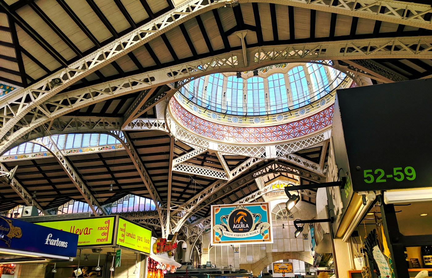 Iron roof trusses and a stained-glass dome inside Valencia’s Central Market