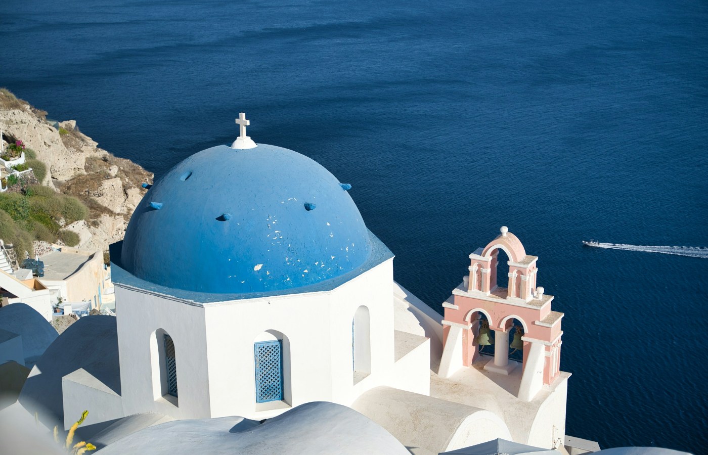 Blue-domed church overlooking the Aegean Sea in Oia, Santorini