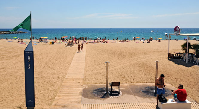 Mar Bella beach, its wooden access walkway and the Mediterranean Sea